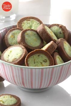 a bowl filled with cookies sitting on top of a table