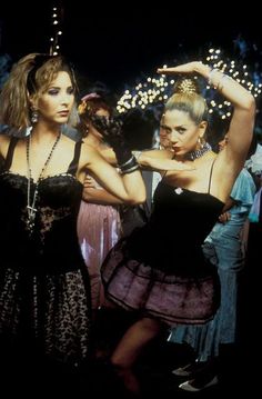 two women in dresses are dancing together with the caption have a romy and michele day