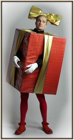 a man dressed up as a person with a box on his head and red shoes