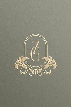 the letter g is inscribed in gold on a gray background