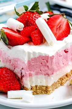 a piece of cake with strawberries and marshmallows on top