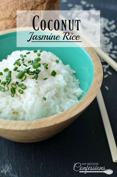 a bowl filled with rice and topped with chopped green onions next to a coconut shell