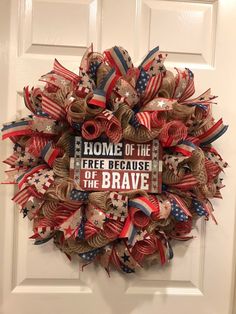 a patriotic wreath with the words home of the free because of the brave