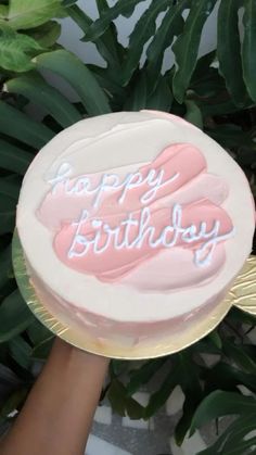 a birthday cake with the words happy birthday written on it in frosting and pink icing