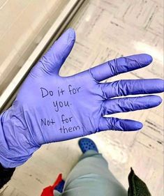 a person wearing purple gloves with the words do if for you not them, because you're the own of your own