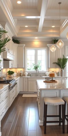 a large kitchen with white cabinets and wooden floors