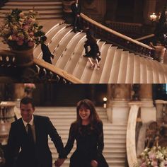 two people are walking down the stairs in suits and ties, one is holding hands with the other