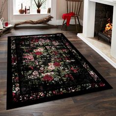 a black rug with flowers on it in front of a fireplace