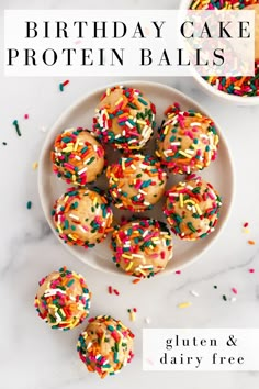 birthday cake protein balls on a plate with sprinkles