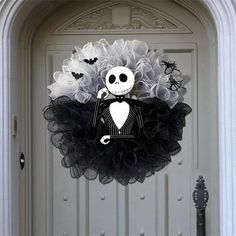 a halloween wreath with a skeleton on it