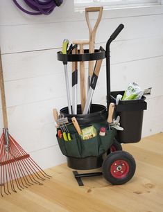 a garden tool caddy with gardening utensils in it