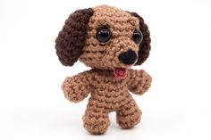 a small crocheted dog with its tongue out