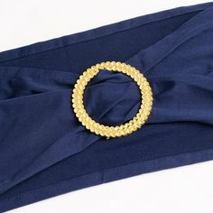 Navy Blue Stretch Chair Sashes Navy Blue Stretch Chair Sashes Elevate your event decor with our Navy Blue Spandex Stretch Chair Sash Bands, adorned with exquisite Gold Diamond Ring Slide Buckles. These chair sash bands are more than just accessories; they are the epitome of sophistication and style. Crafted from high-quality spandex material, these sashes are known for their durability and exceptional flexibility, ensuring a secure and snug fit on various chair sizes and shapes. The deep and all Navy Blue Chair, Chair Bows, Chair Bands, Chair Sash, Chair Sashes, Gold Diamond Ring, Gold Rhinestone, Slide On, Navy Blue Color