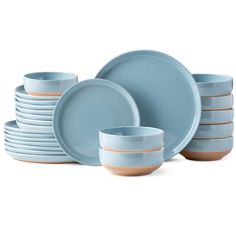 the blue dishes are stacked on top of each other and have brown rimmed plates