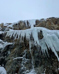 an icy mountain with ice on the rocks