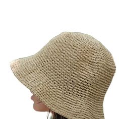 This hat is 100% handmade and crafted from raffia yarn. Raffia yarn is a natural and durable material, ensuring the hat's longevity. The wide brim of the hat is perfect for sun protection and offers a stylish look. This beige hat stands out with its simple and elegant design. It is an excellent accessory for both everyday use and outdoor activities like the beach. Its comfortable and lightweight structure ensures easy and prolonged wear. Raffia. You can store this hat, knitted from raffia rope, in a breathable cloth bag, protect it from fire and heat, and wipe the stains with a clean damp cloth. Beige Woven Beach Hat, Eco-friendly Toquilla Straw Hat, Natural Straw Hat With Natural Fiber, Lightweight Straw Hat, Brown Woven Jute Straw Hat, Adjustable Woven Straw Crochet Hat, Adjustable Straw Crochet Hat, Casual Crochet Hat With Short Brim In Natural Color, Casual Natural Crochet Hat With Short Brim