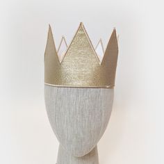 These metallic gold crowns are great for any royal themed event, birthday party, or anyone trying to finish a king, queen, prince, or princess costume. Each crown is made from metallic twill with embroidered edges. Crowns have adjustable hook/loop fastening in the back to fit a range of sizes (one size fits most). OPTIONAL PLUSH SHERPA TRIM - You can choose to have this crown with or without a soft sherpa trim along the bottom. Custom Designs are available upon request. Gold Costume Hats And Headpieces For Carnival, Gold High Crown Costume Hat, Gold Costume Hat With Tall Crown, Gold Tall Crown Costume Hat, Gold Regal Teardrop Crown, Gold Costume Hat With Round Crown For Party, Gold Round Crown Costume Hat For Party, Regal Gold Teardrop Crown, Princess Crown With Structured Design For Party