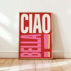 a red poster with the word ciao written in bold pink and yellow on it