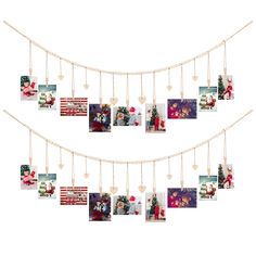 christmas cards hanging on a string with hearts and pictures attached to the strings in front of them