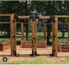 several wooden planters with metal bars on them