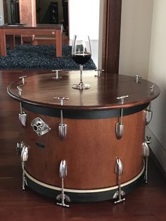 a large wooden table with wine glasses on it