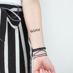 a person with a small tattoo on their arm