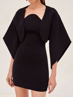 Indulge in luxury and elevate your wardrobe with the Russie Capelet. This elegant garment exudes sophistication, with its sweeping cape-like sleeves and poised neckline that beautifully accentuates the décolletage. It can be worn as a statement piece with the Giasa Mini Dress for a touch of mystery, or layered with the Kamali Midi Dress for a refined and enigmatic look. Model wears XS. Elegant Fitted Cape Dress, Elegant Evening Outerwear, Formal Fitted Long Sleeve Cape, Elegant Structured Outerwear For Evening, Elegant Structured Party Outerwear, Chic Fitted Capelet, Elegant Black Cocktail Outerwear, Fitted Cape Outerwear For Party, Elegant Winter Shrug For Night Out