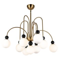 a brass chandelier with white and black glass balls