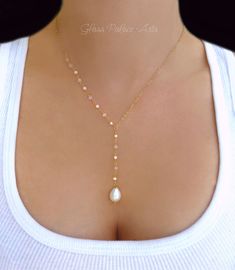 "Freshwater Pearl and Soft Pink Chalcedony Gemstone Necklace Capture the beauty of genuine pearls with this teardrop pearl necklace - Attached are genuine freshwater pearls and soft pink chalcedony gemstones - 14k gold filled, or sterling silver chain and spring clasp - Length of the chain that goes around the neck (not including dangle section) is shown at 17\" - The pearl dangle is approx 2 inches additional length - Choose your favorite length during checkout - The tiny gemstones and pearls a Freshwater Necklace, Necklaces Ideas, Pearl Lariat Necklace, Pearl Lariat, Diamond Initial Necklace, Bridal Pearl Necklace, Pink Chalcedony, Wedding Unique, Long Pearl Necklaces