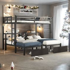 two bunk beds in a room with christmas lights on the windowsill and a tree