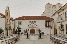 an outdoor wedding venue with tables and chairs