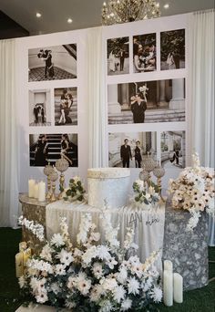 a wedding cake sitting on top of a table next to flowers and candles in front of pictures