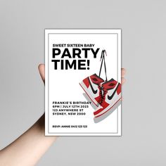 a hand holding up a card with a pair of sneakers on it and the text sweet sixteen baby party time