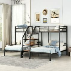 a bunk bed sitting next to a window in a room with white walls and wooden floors