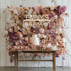 an image of a table with flowers on it and the words emly's bridal shower