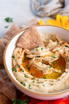 hummus with pita chips on the side