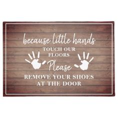 a sign that says because little hands touch our floors please remove your shoes at the door