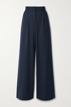 Veronica Beard's 'Heyser' pants are made from navy twill that's woven with subtle metallic pinstripes for an elongating effect and a touch of sparkle. They have soft pleats that enhance the wide legs and can either be worn at the waist or low on the hips, depending on your preference - just choose your size accordingly. Wear them with a collared shirt or chunky sweater. Vertical Stripes Long Pants For Work, Vertical Stripes Pants For Workwear, Elegant Navy Wide-leg Bottoms, Elegant Navy Wide-leg Pants, Basic Outfit Pieces, Chic Tailored Bottoms With Vertical Stripes, Elegant Straight Leg Pants With Vertical Stripes, Blue Vertical Stripes Workwear Pants, Blue Vertical Stripes Pants For Workwear