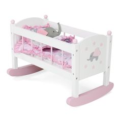 a white wooden baby crib with pink bedding and elephant decals on it