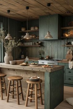 a kitchen with green cabinets and wooden stools