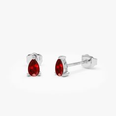 Gold Kt: 14K Solid Gold Available Gold Colors: Yellow Gold, White Gold Pear Shape Ruby: 2 pcs 5 x 3 MM Ruby Carat Weight: 0.45 ctw Ruby Stud Earrings, Ruby Earrings Studs, Gold Colors, Pear Shape, Pear Shaped, Solid Gold, Gold Color, Pear, Ruby