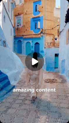 a person walking down an alley way with blue buildings in the background and text reading amazing content