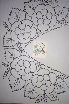 a drawing of flowers and leaves on a sheet of paper with the word love written in it