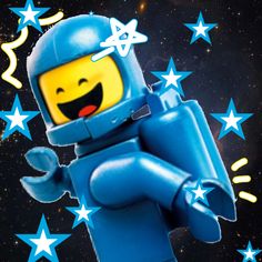 a blue lego man with stars around him and his arms spread out in the air