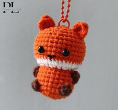 a crocheted animal keychain hanging from a chain