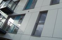 an apartment building with multiple balconies and windows