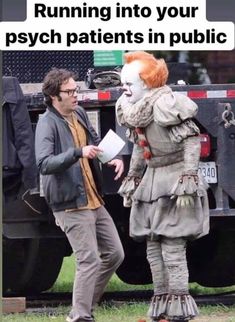 a man standing next to a creepy clown in front of a garbage truck on the street