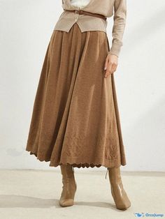 Orcajump - Flared Wool Midi Skirt with High Waist, Loose Fit, and Figure-Flattering Knitted Design Solid Beige Skirt For Fall, Beige Solid Color Skirt For Fall, Solid Color Beige Skirt For Fall, Brown Full Skirt Bottoms For Winter, Brown Skirted Bottoms For Fall, Solid Color Flared Skirt Bottoms For Fall, Solid Color Flared Skirt For Fall, Relaxed Knit Skirt For Fall, Knit Relaxed Skirt For Fall