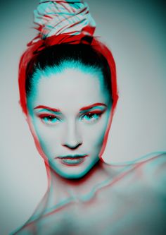 a black and white photo of a woman with a bun in her hair