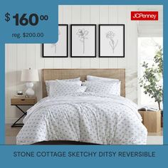 a bed with white sheets and pillows in front of a blue background that says stone cottage sketchy reversible